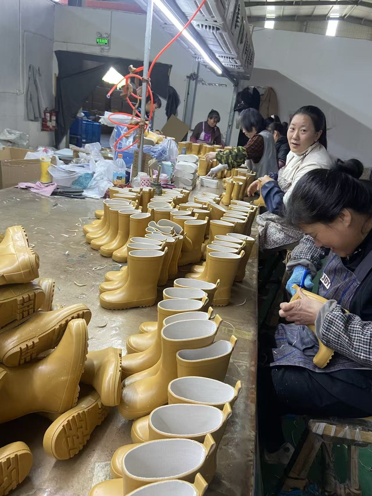 Rubber boots trimming and finishing process