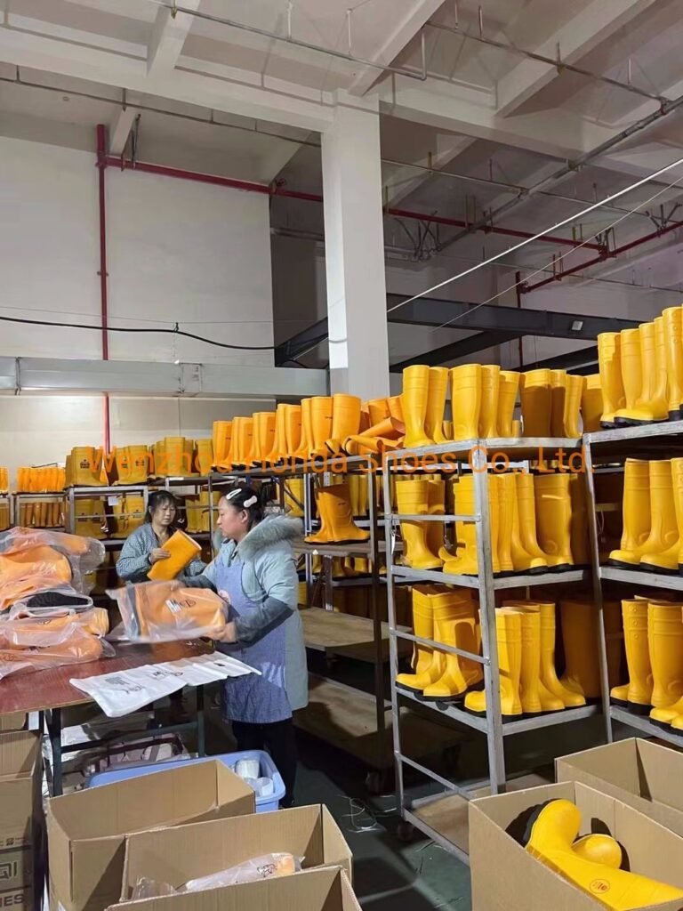 final inspection of PVC rain boots before packing